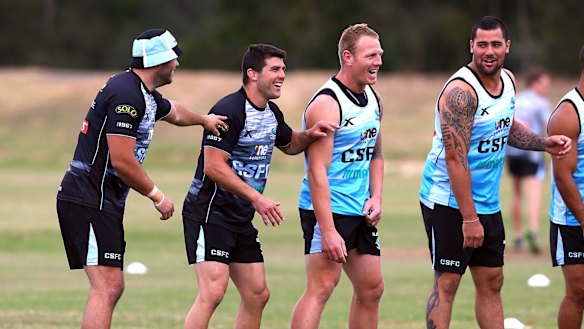 Pre-season training: Wade Graham, Michael Ennis, Luke Lewis and Andrew Fifita joke around during a Cronulla Sharks training session at Remondis Stadium.