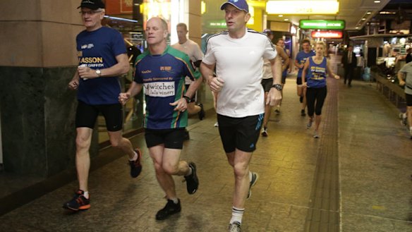 Tony Abbott goes out for an early morning run with Queensland Premier Campbell Newman, centre, in Brisbane on Saturday before flying out to Arnhem Land.