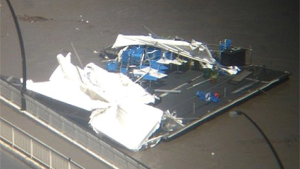 Drift's side pontoon cafe is detached and floating down the river. Photo: Brisbane Twitter user @yangwong