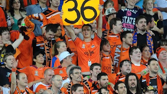 Record breaking ...Roar fans cheer during the round eight A-League match between Brisbane and the Perth Glory at Suncorp Stadium on November 26.