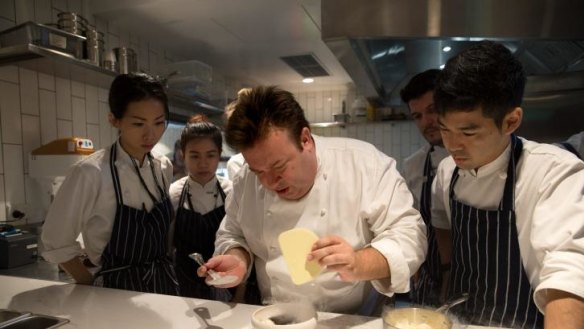 Chef Peter Gilmore making a Cherry Jam lamington in the kitchen of Bennelong at the Opera House.