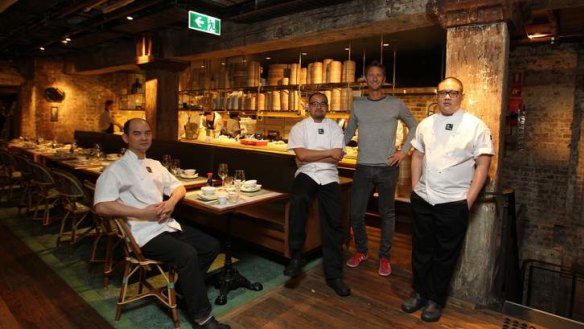 Culinary revolution ... Justin Hemmes (in grey) with Mr Wong chefs, left to right: Eric Koh, Jowett Yu and Dan Hong.
