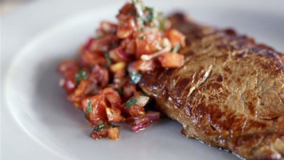 Steak with tomato and red onion salsa