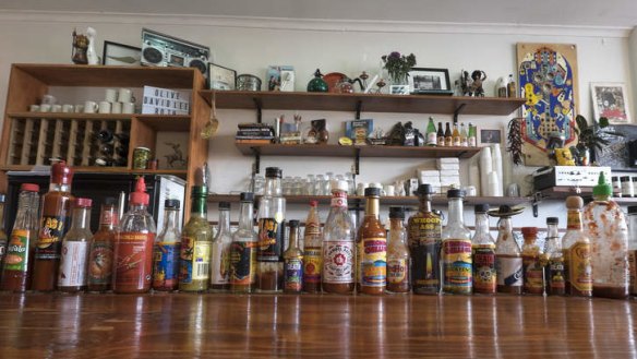Rock 'n' roll: A line-up of hot sauces along the bar.
