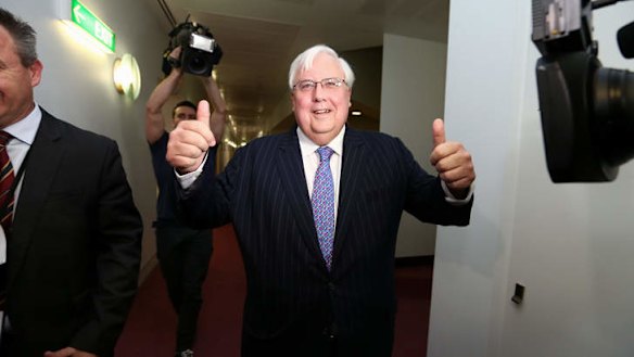 Palmer United Party leader Clive Palmer departs after addressing the media during a press conference in the press gallery. Photo: Alex Ellinghausen