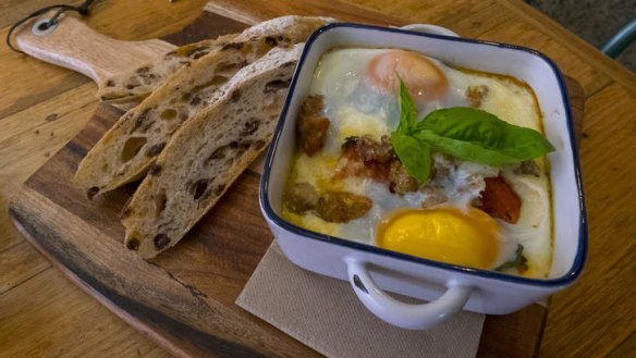 Baked eggs with tomato sugo and pork sausage.