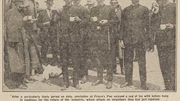 Time for a cuppa: Police take a break before dealing with the unionists on Princes Pier in 1928.