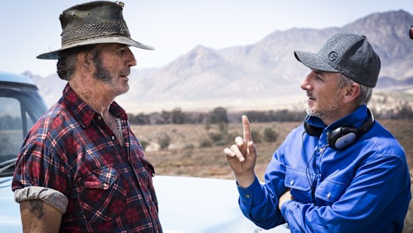 Taking the Mick ... Director Greg McLean (right) on the set of <i>Wolf Creek 2</i> with John Jarratt.