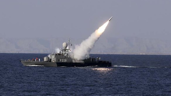 A new medium-range missile is fired from a naval ship during Velayat-90 war game on Sea of Oman near the Strait of Hormuz in southern Iran.