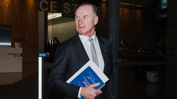 Former Wallabies captain turned Bell Potter managing director Simon Poidevin leaving the Administrative Appeals Tribunal.