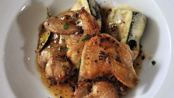 Crisp skin quail with a honey pepper black bean glaze.