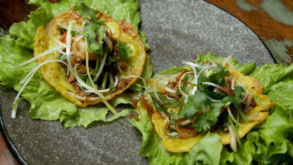 Crispy coconut wafer, filled with pork, prawn, bean shoots and fresh herbs.