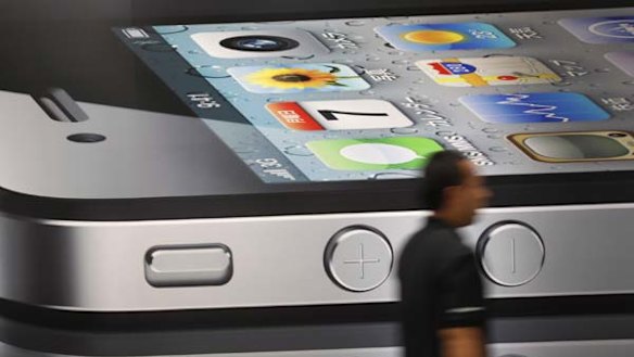 A poster of Apple's latest iPhone 4 which has suffered from a range of glitches.