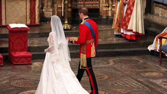 The couple approach the altar together.