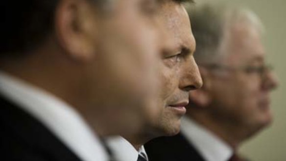 Opposition Leader Tony Abbott, flanked by his Treasury spokesman, Joe Hockey, and finance spokesman, Andrew Robb.