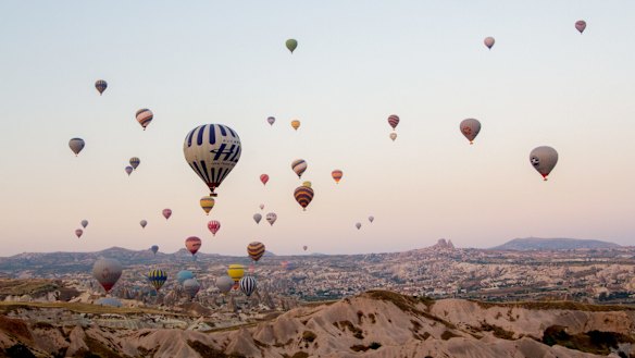 The skies above Cappadocia are filled with hot air balloons.