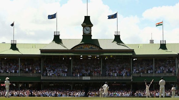 Sachin Tendulkar celebrates reaching his century in front of the SCG's iconic Members' Pavilion.
