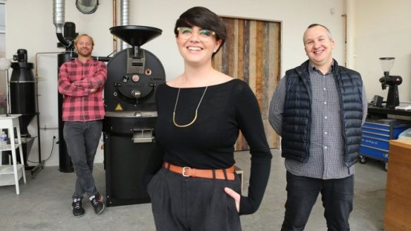 Firing up: Nathan Toleman (right) with business partners Ben Clark and Elika Rowell at Square One Roastery.