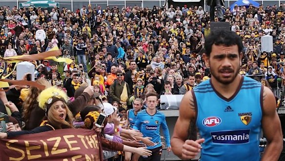 Cyril Rioli is urged on at Hawthorn training.