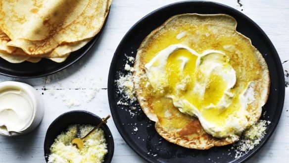 Crepes with citrus sugar and sour cream. 