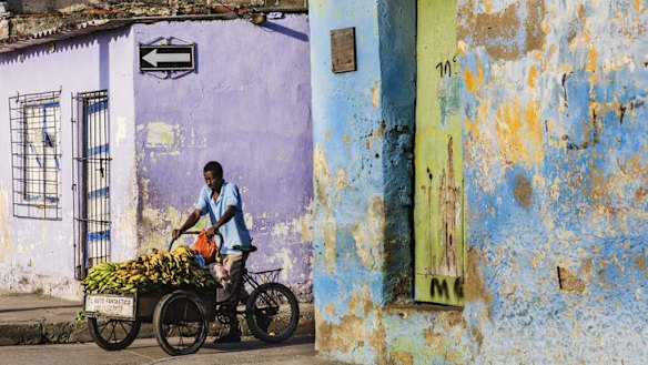 A fruit seller on Cartagena's colourful streets in Colombia.