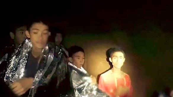 Adul Sam-on on right in a section of Tham Luang Cave.