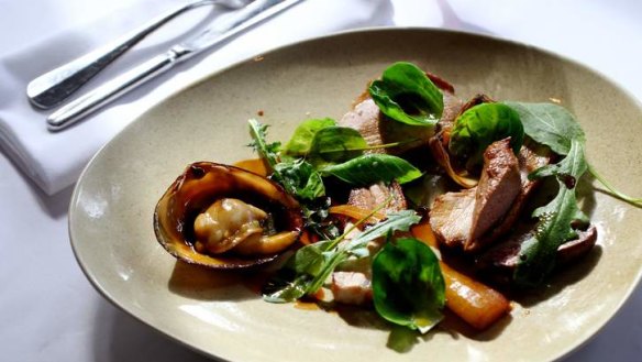 Suckling pig with clams, sprouts and parsnips.