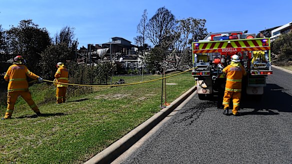 The Rural Fire Service was on scene within 15 minutes of the first triple zero calls, but declined offers for help from NSW Fire and Rescue until the fire was bearing down on Tathra's streets.