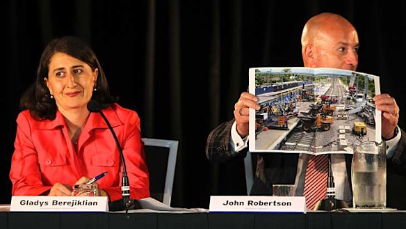 Life in the fast lane ...  Gladys Berejiklian and John Robertson at the forum last night.