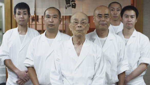 Jiro Ono, centre and his son Yoshikazu Ono, directly to the right of Jiro, from Jiro Dreams of Sushi.