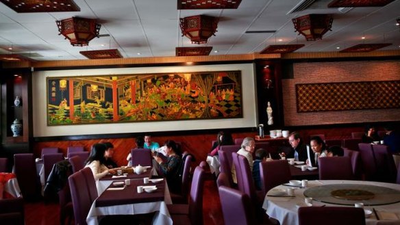 The dark and elegant dining room at Tao Tao House.