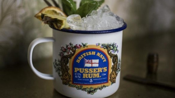 "The Motley Crew" cocktail is served in a Pusser's Rum enamel cup.