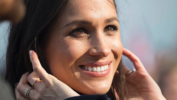 Meghan Markle looks on during a walkabout with Britain's Prince Harry on the esplanade at Edinburgh Castle,.
