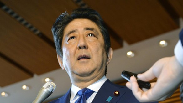 Japanese Prime Minister Shinzo Abe speaks to the media as he expresses support for the US missile attack on a Syrian government-controlled air base.
