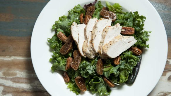 Kale, fig and maple-glazed pecan salad with pomegranate dressing.