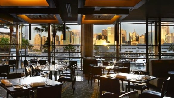The glitzy interiors at Black by Ezard are framed by a harbour view.