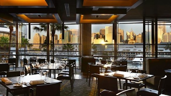 The glitzy interiors at Black by Ezard are framed by a harbour view.