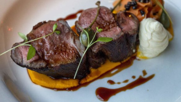 Lamb rump on a bed of carrot puree.