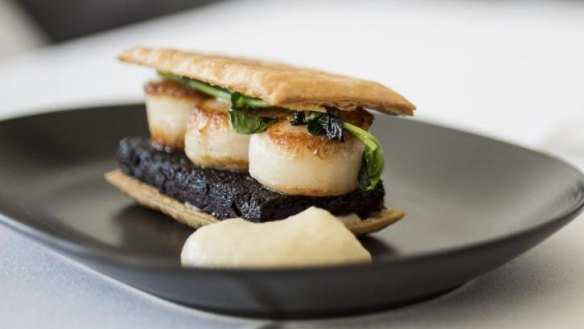 The seared scallops with boudin noir pastry.