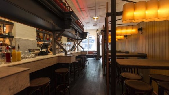 Moody atmosphere: Murals and white marble have transformed the former pub.