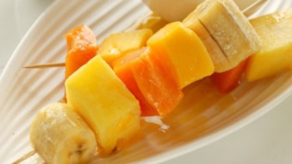 Tropical fruit skewers with white rum and sago pudding