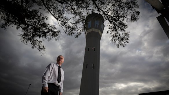 Air traffic control operations manager Charles Robinson seen outside the main air traffic control tower at Melbourne Airport.
