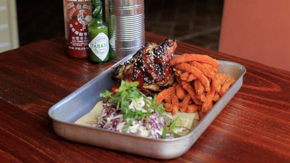 Coke-Can Chicken with sweet potato fries and sesame slaw.