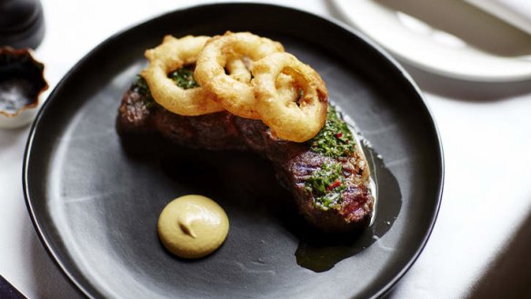Whole dry-aged rib-eye with a trio of onion rings.