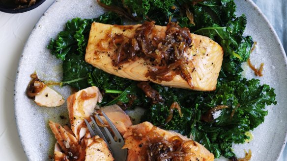 Quick, healthy dinner: Salmon fillets with caramelised onion and wilted greens.