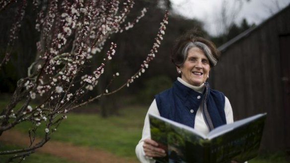 Let's do the thyme walk again: Danielle Hyndes in the orchard at Calthorpes' House in Red Hill perusing the <i>Highgrove: A Garden Celebrated</i>.