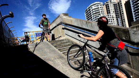Cyclists on the steps leading up to the Harbour Bridge. 
