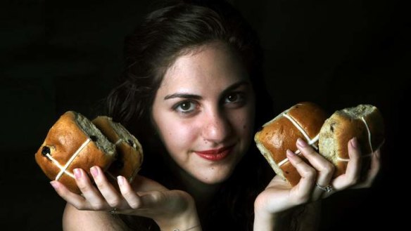 Gemma Khaicy holds some of the hot cross buns that will sell in their millions.