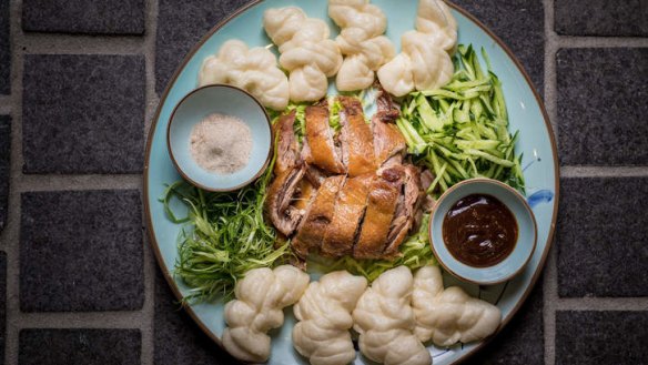 Fragrant crisp-skinned duck with steamed buns.