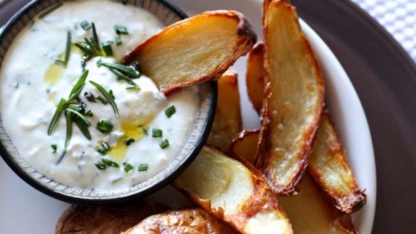 Crispy potato skins with garlicky cheese dip.